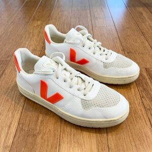 Veja white and orange vegan mens sneaker.